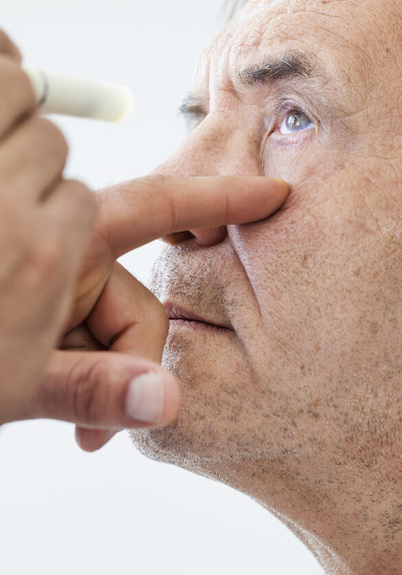 Elderly man examined by an ophthalmologist